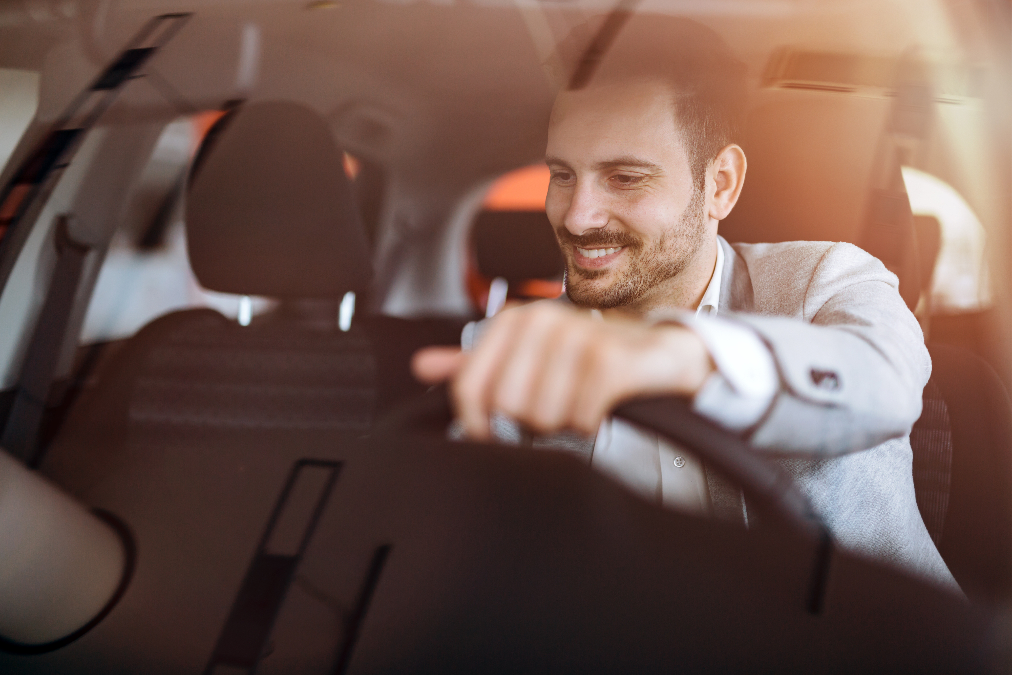 Man driving away with goldenlease car